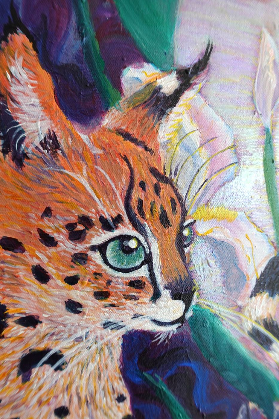Close-up of Loved Wildly: a green-eyed wildcat among iris petals and leaves